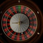 Ein Roulette-Rad von oben fotografiert – die Kugel steht auf der roten 23.